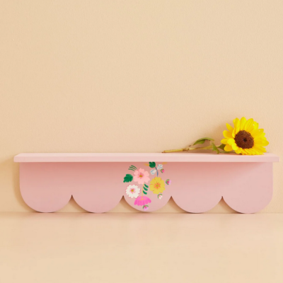Pink wooden shelf with painted flowers